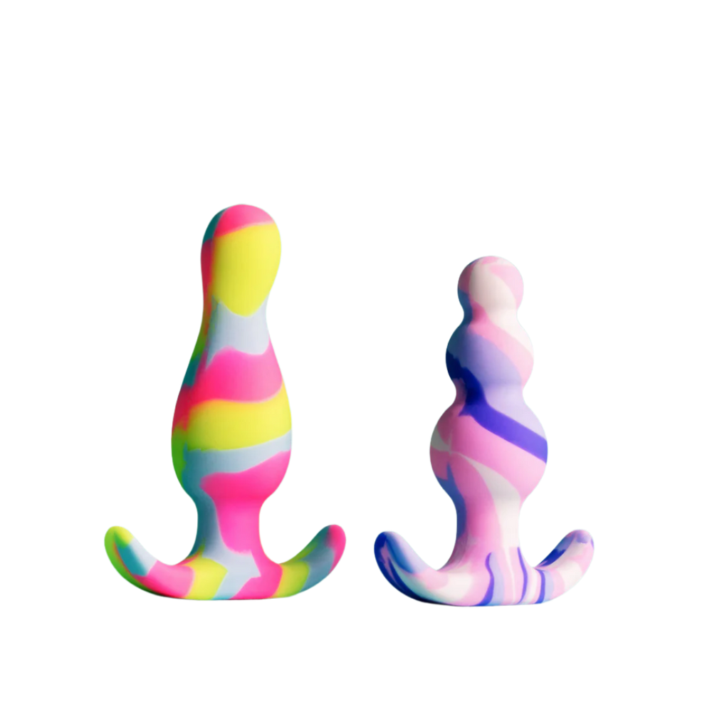 
                  
                    Two colorful silicone butt plugs on a white background
                  
                